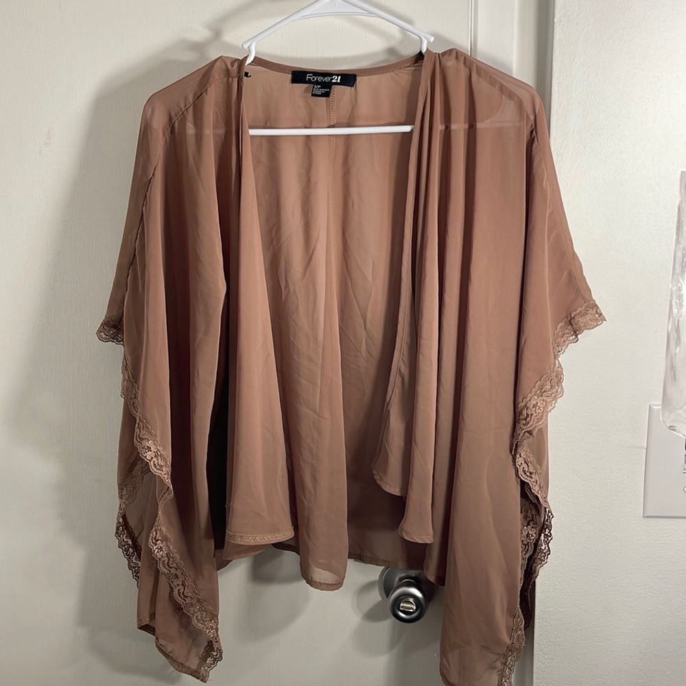 Sheer tan cardigan with lace detail on the arms
